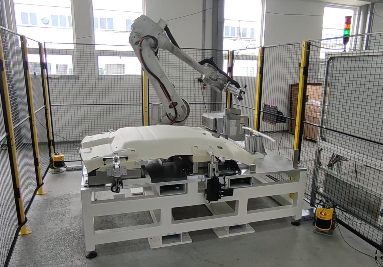 Robotic workstation for ultrasonic cutting of headliners